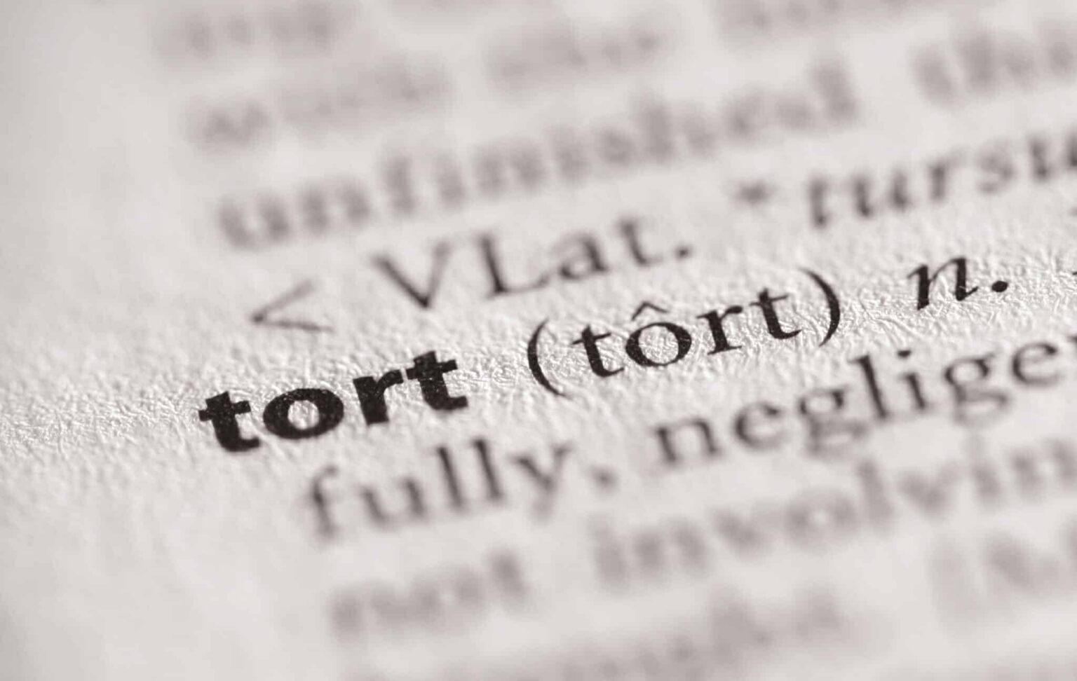 Close up of tort definition in dictionary | Daniel Stark Injury Lawyers