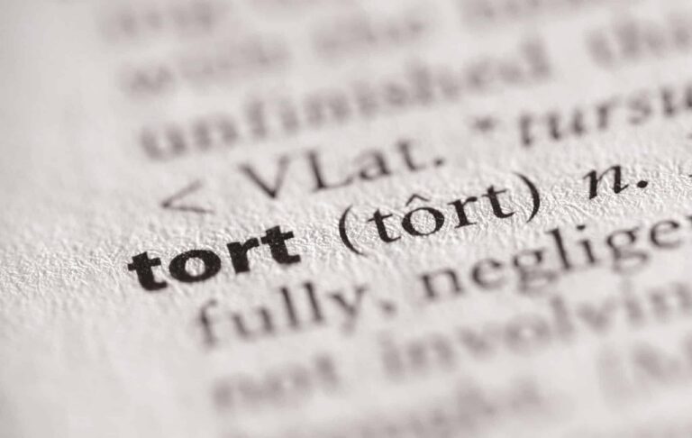 Close up of tort definition in dictionary | Daniel Stark Injury Lawyers