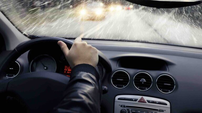 Person driving on road during storm; bad weather | Daniel Stark Injury Lawyers