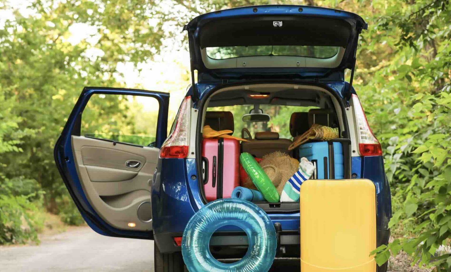 SUV packed with luggage and pool floats before an out-of-state family vacation | Daniel Stark Injury Lawyers