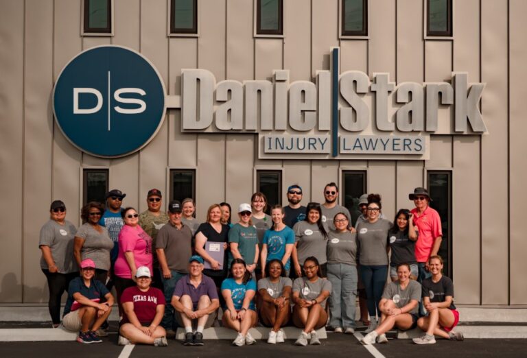 Daniel Stark team gathers in front of Killeen office building during community partnership event with Texas AgriLife | Daniel Stark Law