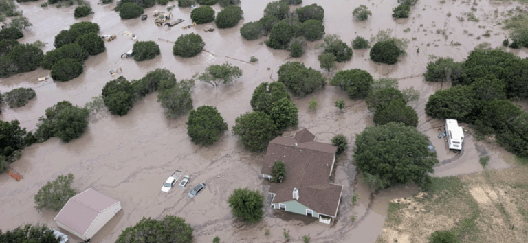 Aerial photo of a neighbourhood partially under water during a flash flood in Texas | Daniel Stark Law