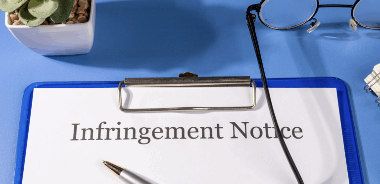 blue clipboard on desk with Intellectual Property Infringement Notice | Daniel Stark Law