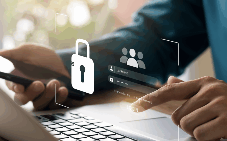 Close-up of a person using laptop and smartphone, entering username and password with digital padlock symbol for online security | Daniel Stark Law