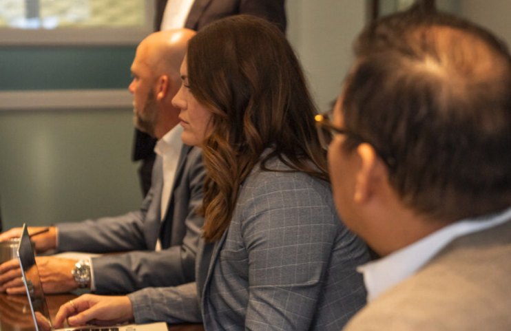 Daniel Stark attorney team lead Myranda Vaughn collaborates with fellow attorneys during a litigation strategy meeting | Daniel Stark Law