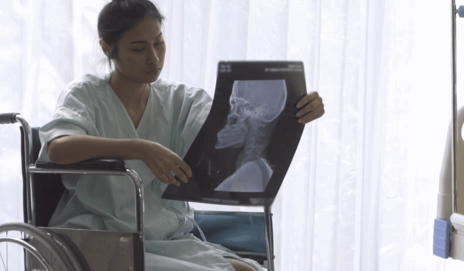 Patient reviewing X-ray results in hospital, concerned about medical condition | Daniel Stark Law