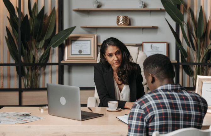 Lawyer meeting with a tired client to discuss settlement concerns | Daniel Stark Injury Lawyers