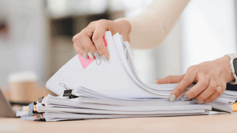 Close view of legal files in hands of a professional female attorney | Daniel Stark Injury Lawyers