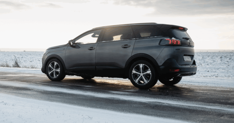 Silver SUV navigating icy country roads in winter | Daniel Stark Injury Lawyers