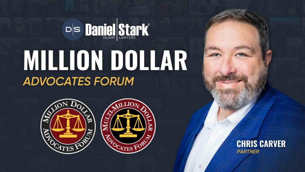 Christopher Carver, partner and attorney at Daniel Stark Injury Lawyers, pictured with Million Dollar Advocates Forum and Multi-Million Dollar Advocates Forum badges | Daniel Stark Injury Lawyers