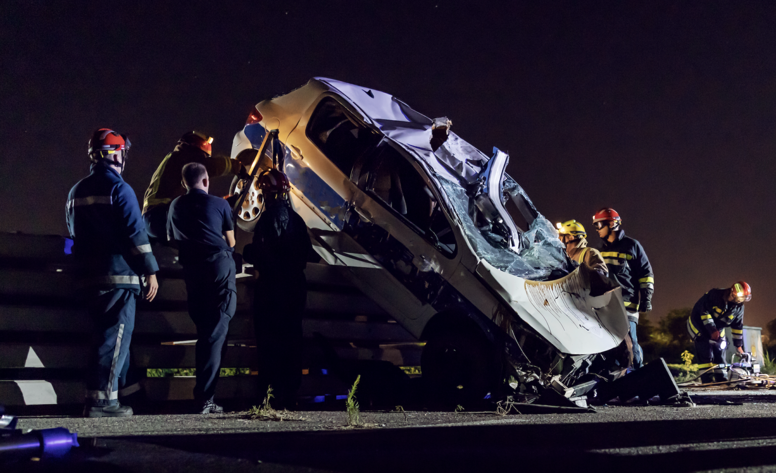 Emergency responders clearing a fatal car accident scene on a highway | Daniel Stark Injury Lawyers