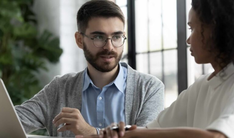 Woman speaking with a personal injury attorney in a law office during a consultation | Daniel Stark Injury Lawyers