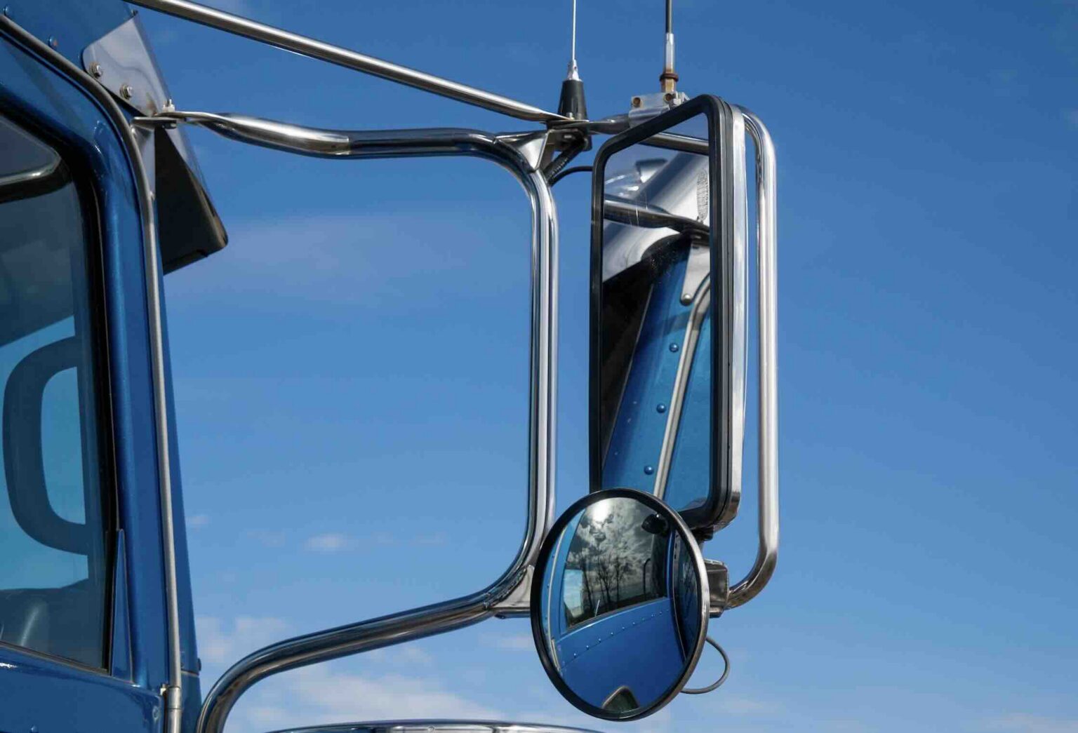 Close-up view of semi-truck mirrors used to monitor surrounding traffic and truck blind spots | Daniel Stark Injury Lawyers