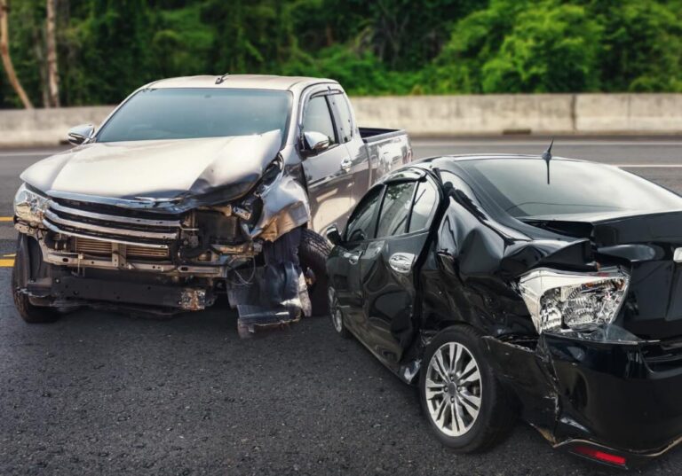 Gold pickup truck and black car after a T-bone collision | Daniel Stark Injury Lawyers