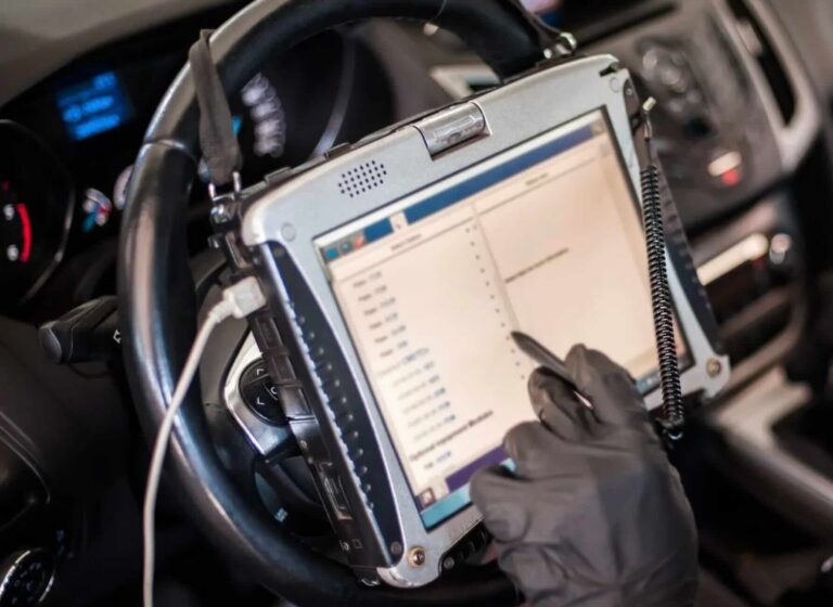 Accident Reconstructionist downloading black box data to computer after car accident | Daniel Stark Injury Lawyers
