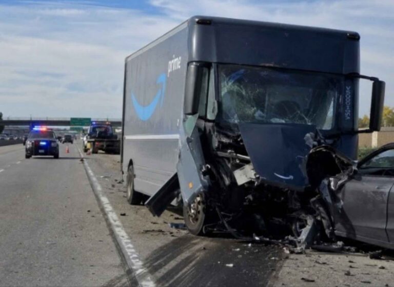 Amazon delivery truck in head on collision with small black sedan on highway | Daniel Stark Injury Lawyers
